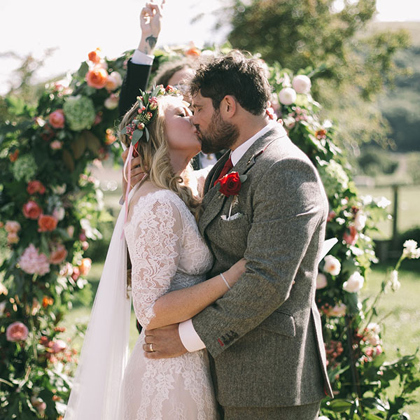 Sam's buttonhole, the floral arch & a beautiful moment